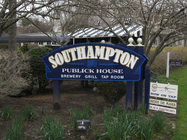the blue sign for the southham pub, with the name in english