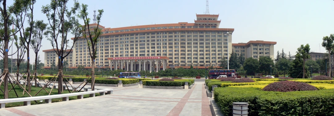 an outdoor walkway next to buildings and trees