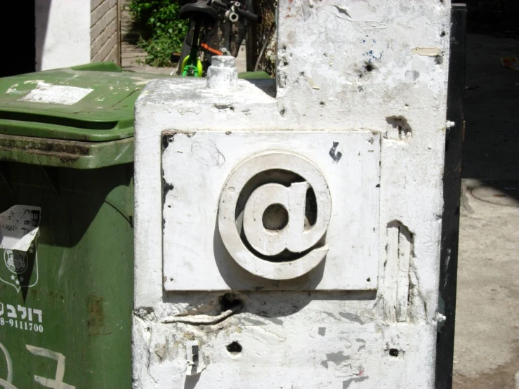 a large green box with the letter at written on it