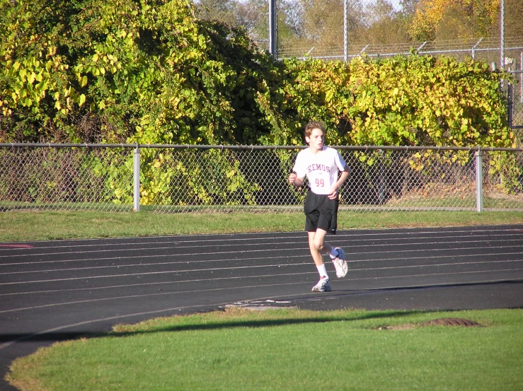 a man is running on a track at a track