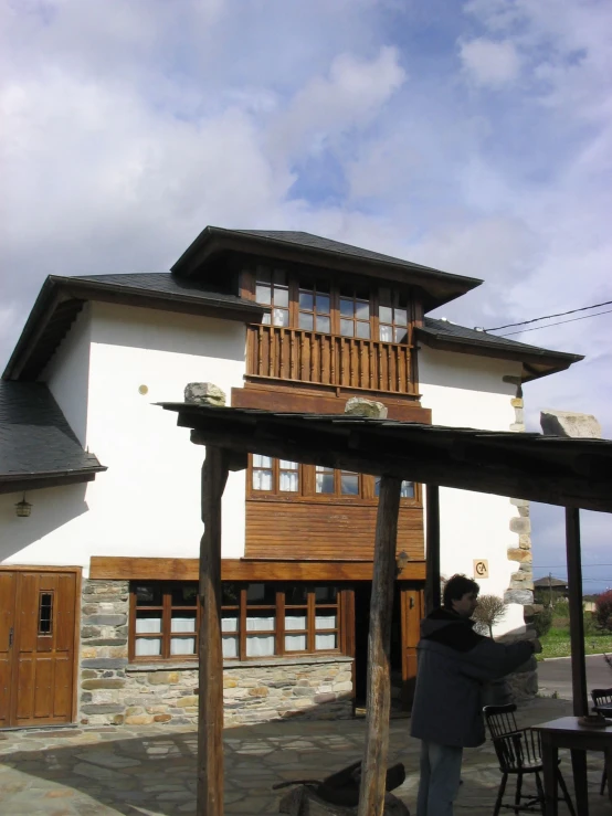 a person standing in front of a house