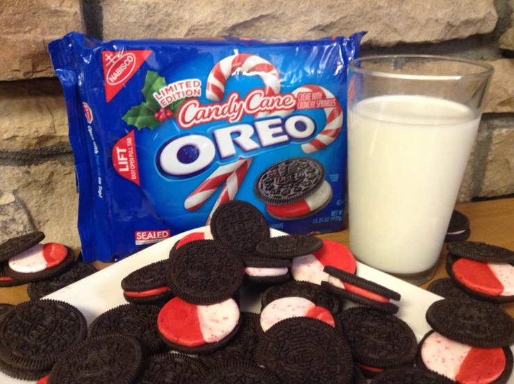 oreos on a plate with chocolate and candy, milk and pepperoni