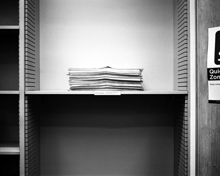 an empty white closet with a lot of paper