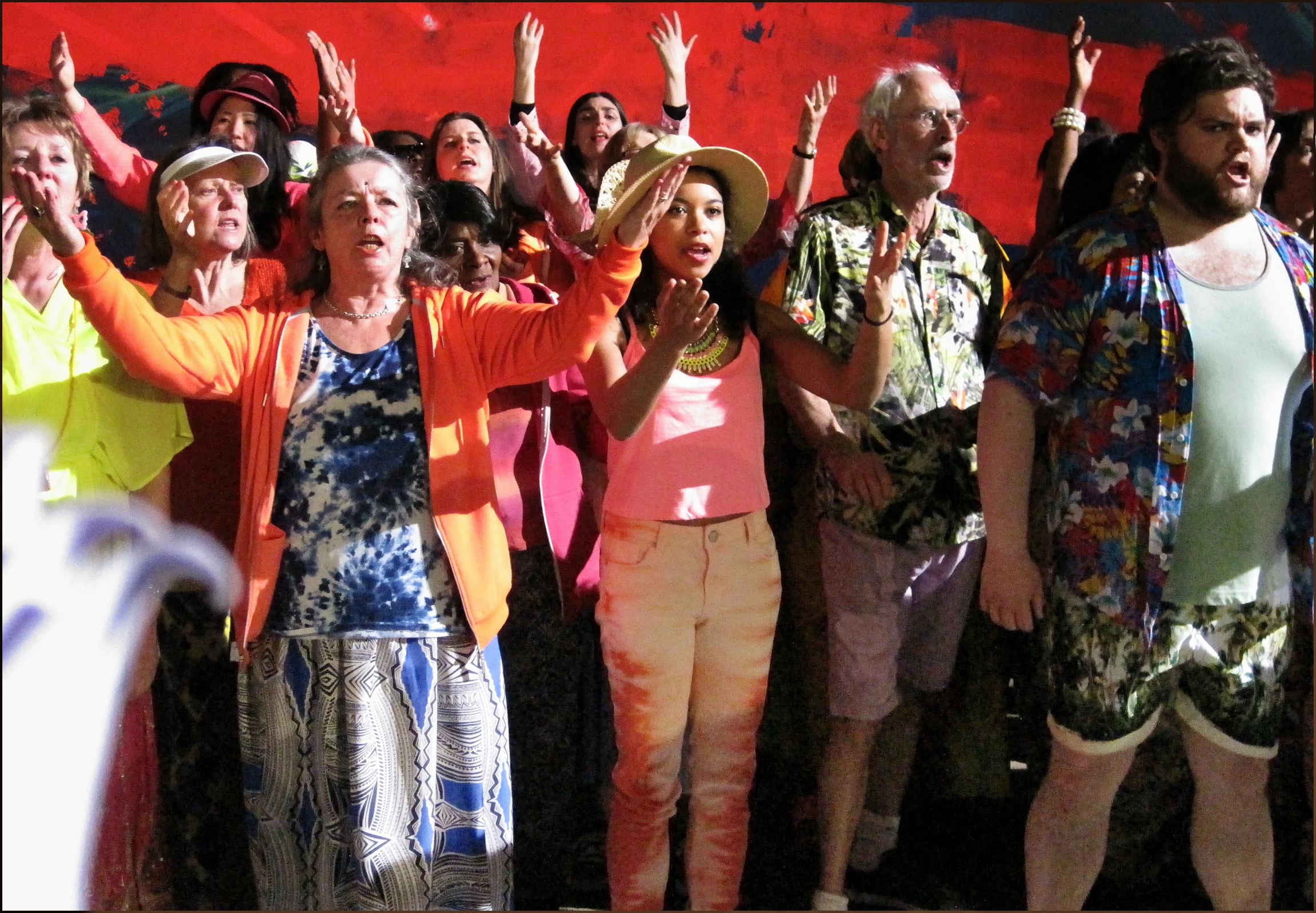 a group of women and man standing next to each other