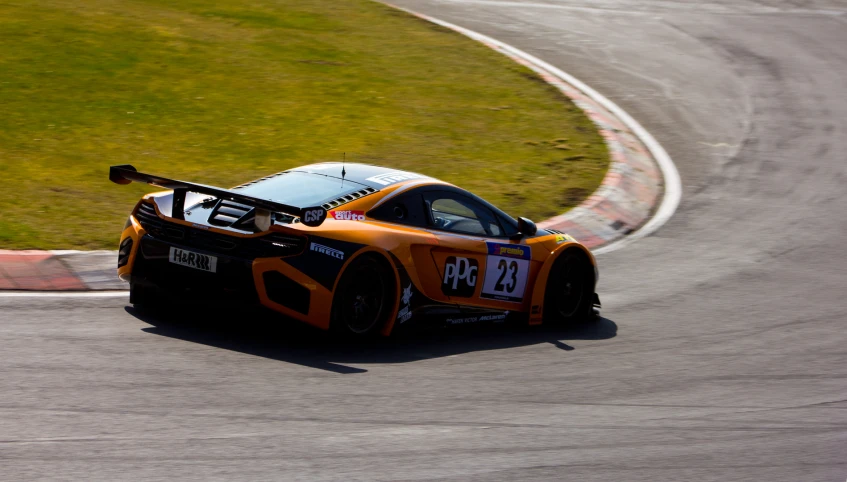 a sport car racing around a corner on the road