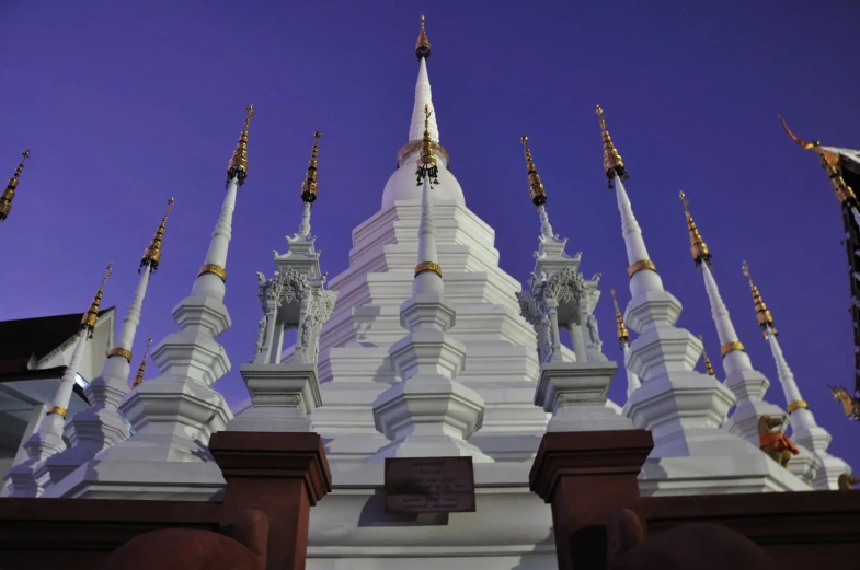 the tops of several ornately painted white buildings