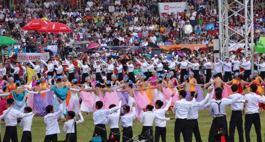 a group of people dancing and holding umbrellas