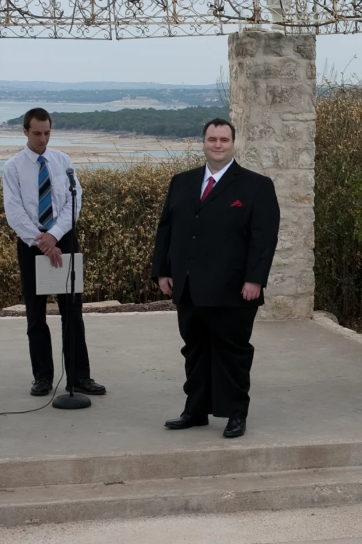 two men standing near each other on a ledge