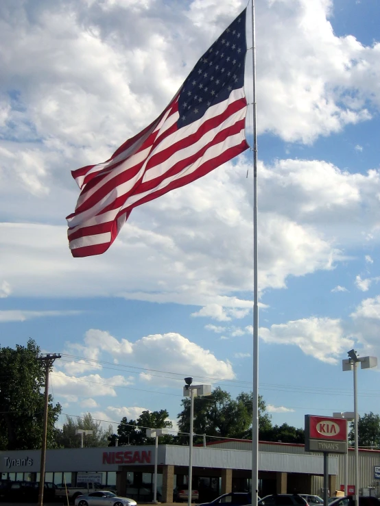 an american flag is flying on a flagpole