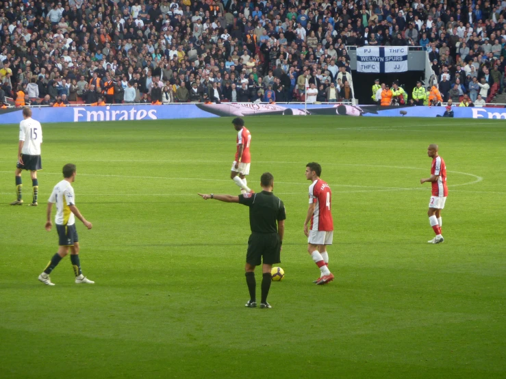 there are several players playing a soccer game