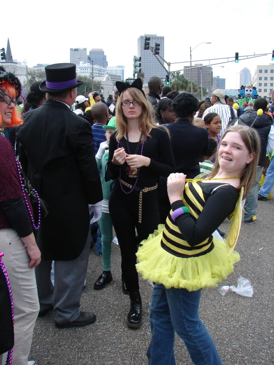 woman dressed in bee costume pointing to someone on the street