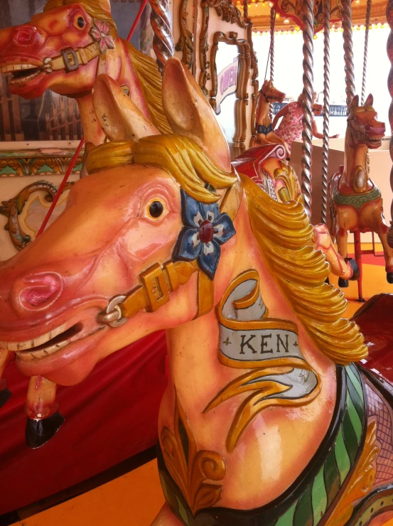 an elaborately painted horse on a merry go round