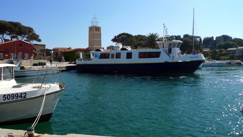 a large boat sits on top of the lake