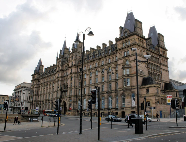 a traffic light sitting in front of a large building