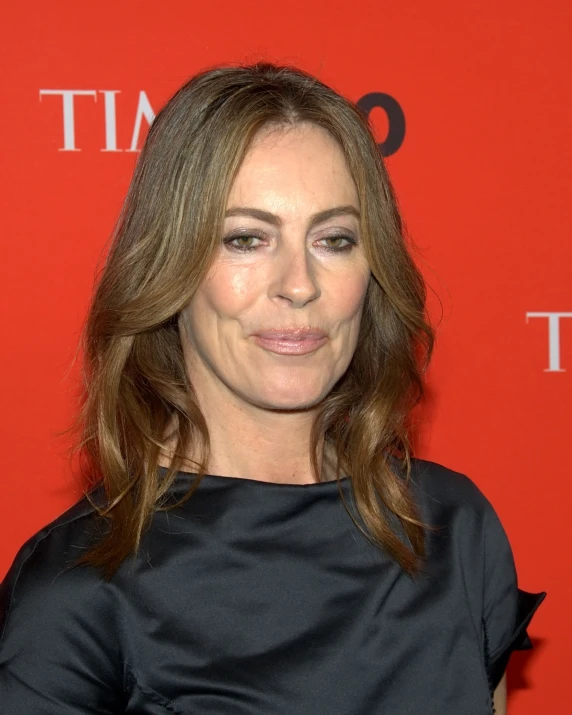 a woman standing on top of a red carpet