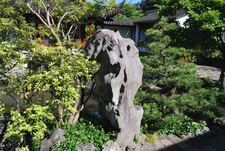 an interesting looking stone in a garden