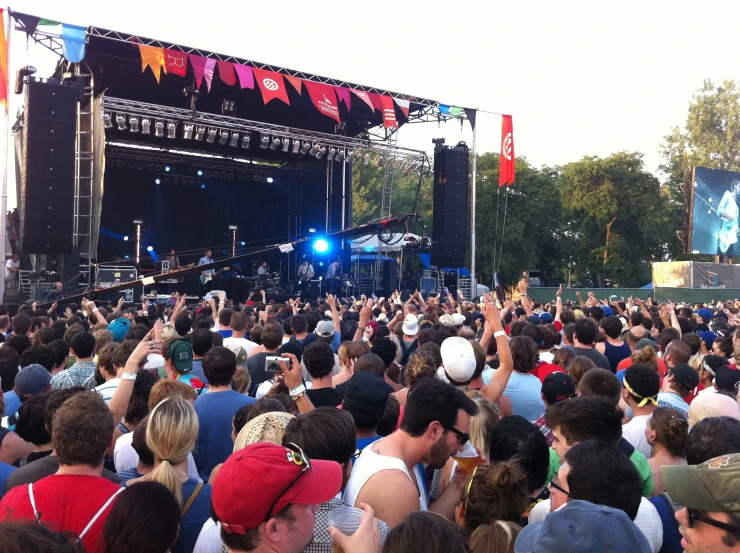 a crowd of people gathered together in a park