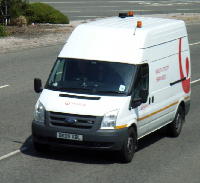 an ambulance is shown driving down a street