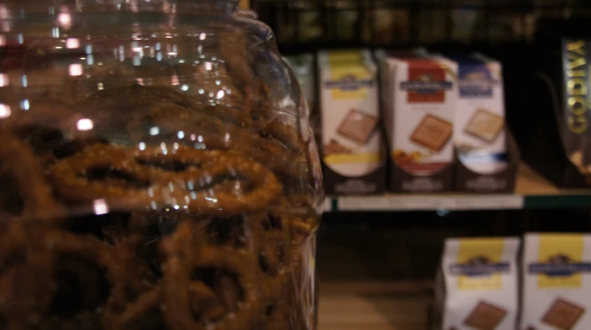 a jar filled with lots of pretzels in a store