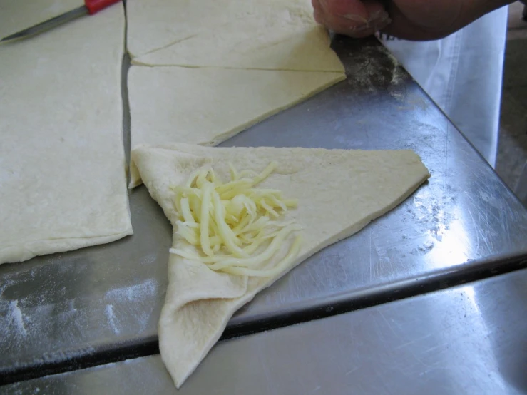 someone  and making some food on a table