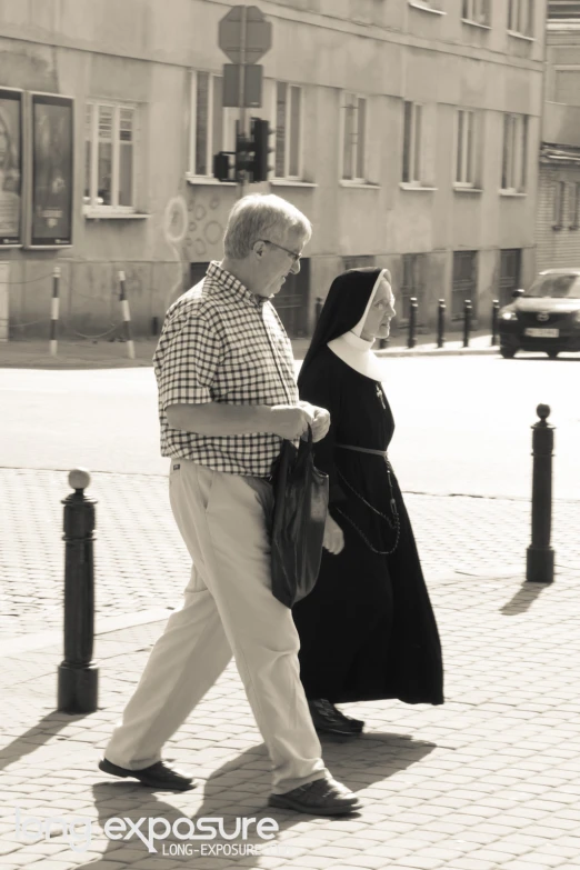 black and white pograph of man and woman walking together