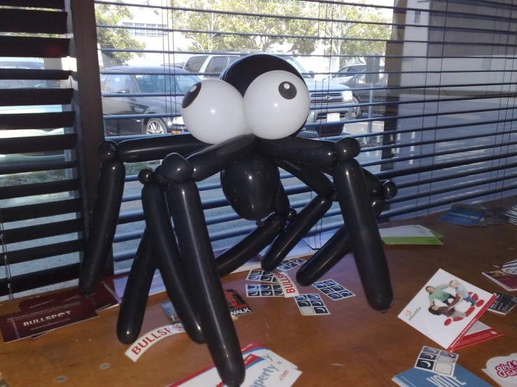 an image of a giant balloon spider on a table