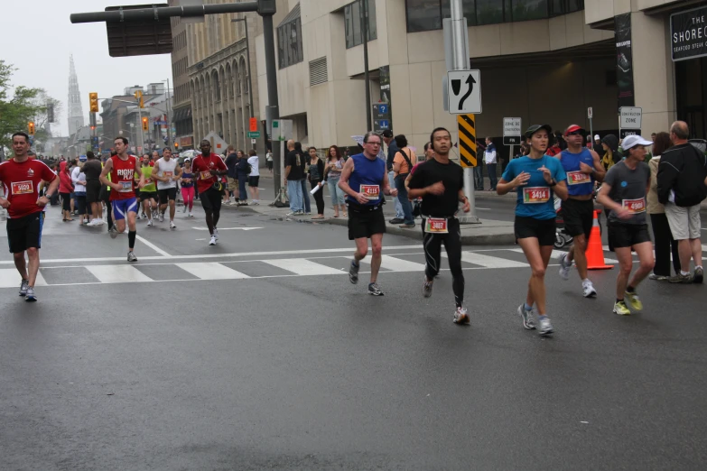 people are running in a marathon in a city