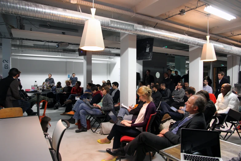 a room filled with people sitting down together