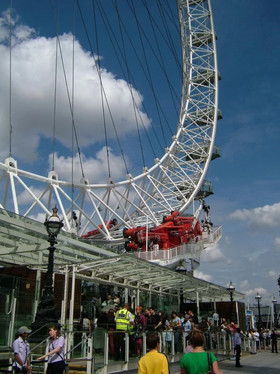 a huge ferris wheel on the side of a building