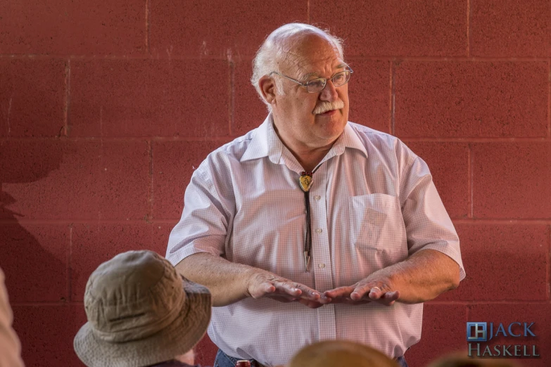 man with hand in pocket at an event