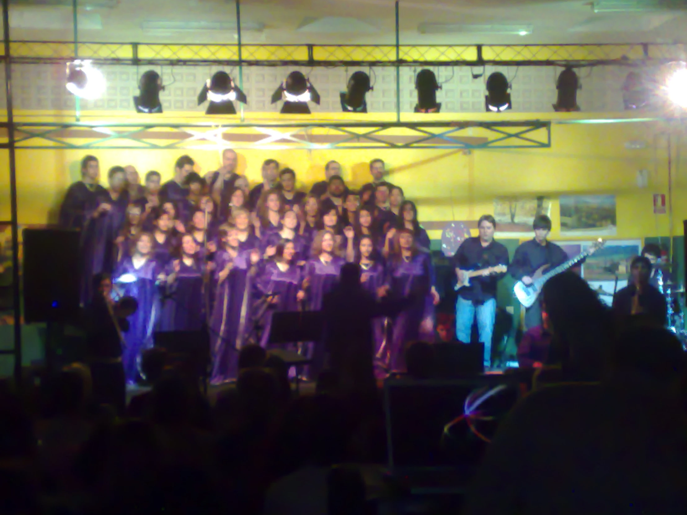 a group of people in front of a stage