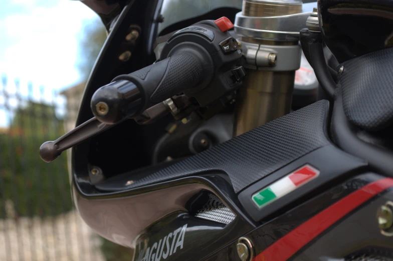 a close up of a black and red motorcycle