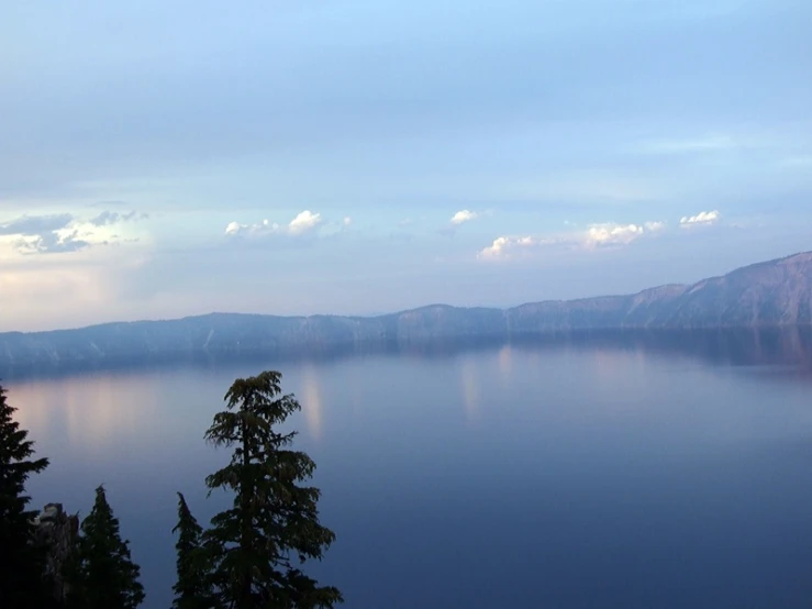 view of trees and the surrounding mountains and lake