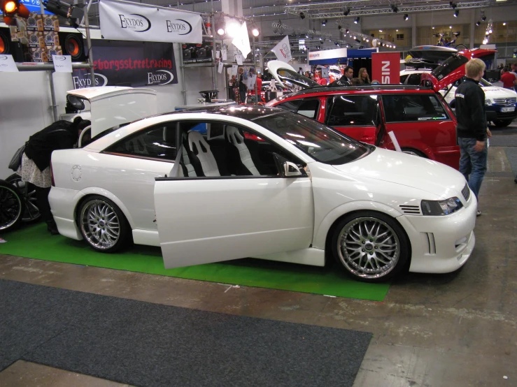 a group of vehicles on display at a show