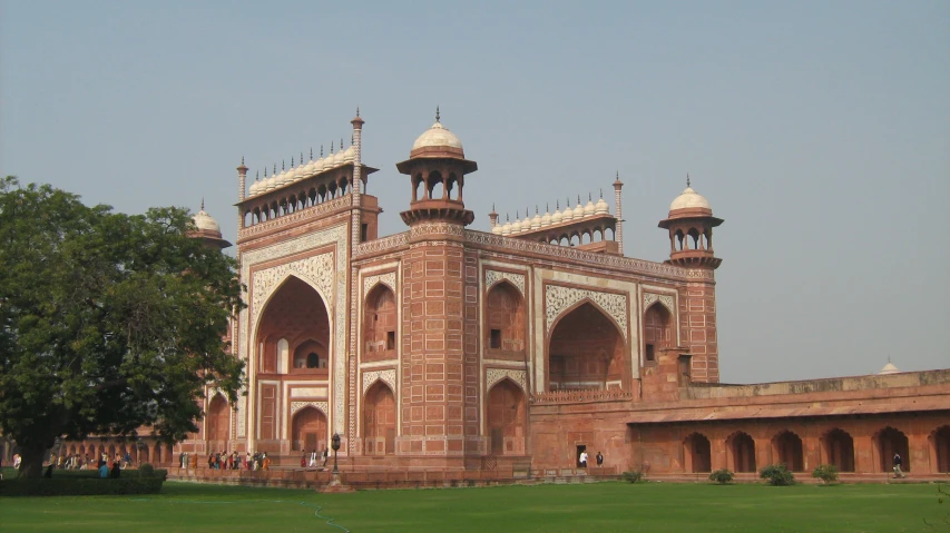 a large brick building with towers and domes