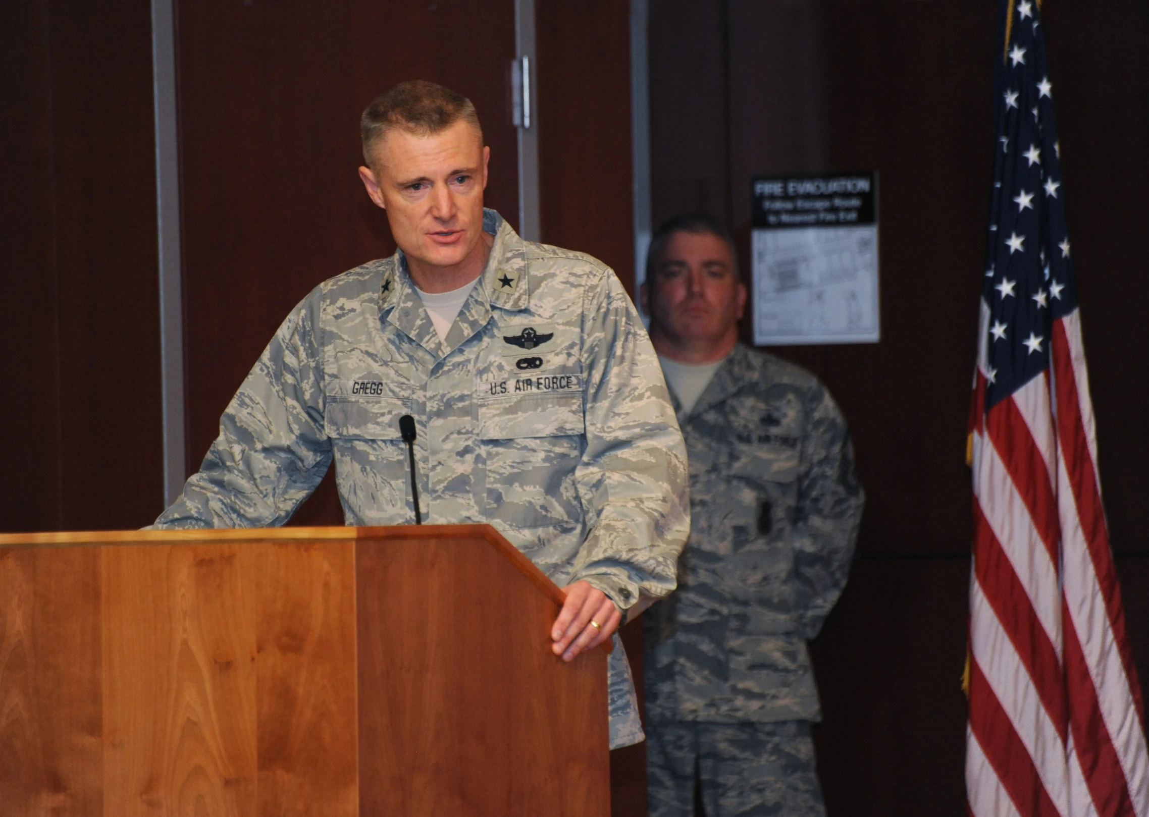 a soldier giving a speech at a podium