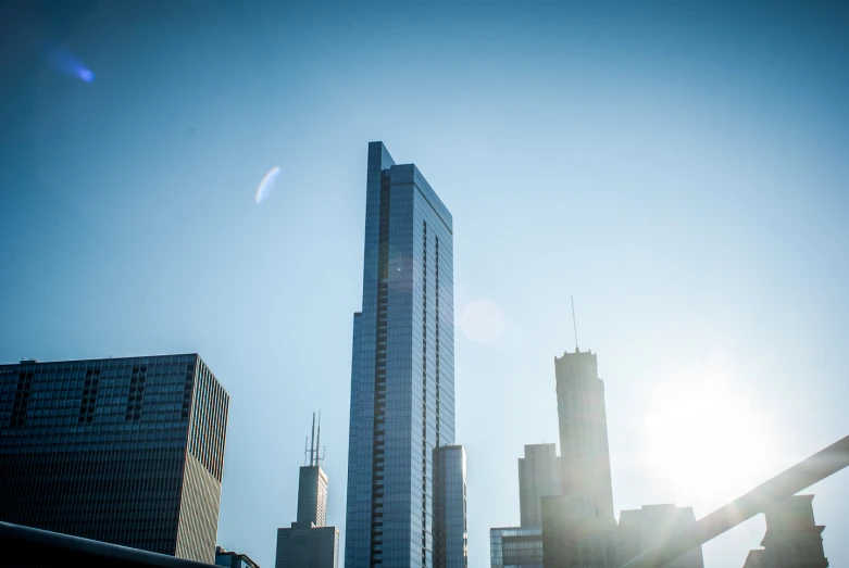 two buildings stand in front of each other in the distance