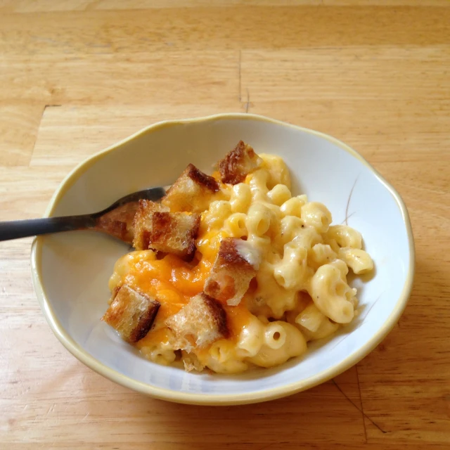 a pasta and cheese dinner is served on the table