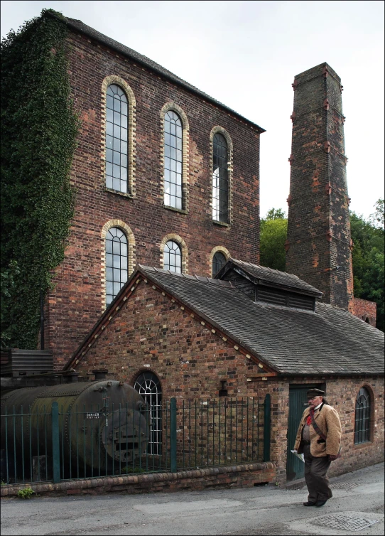 a man is standing in front of a building