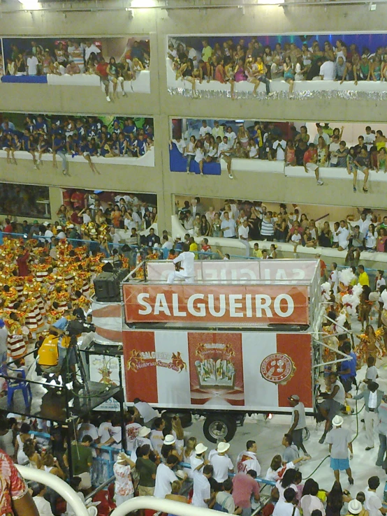 a crowd of people in an arena watching an event