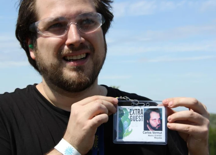 a man holding up a po in front of his face