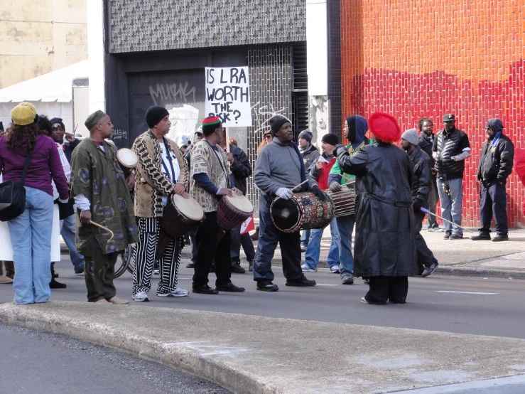 a group of people standing in the street