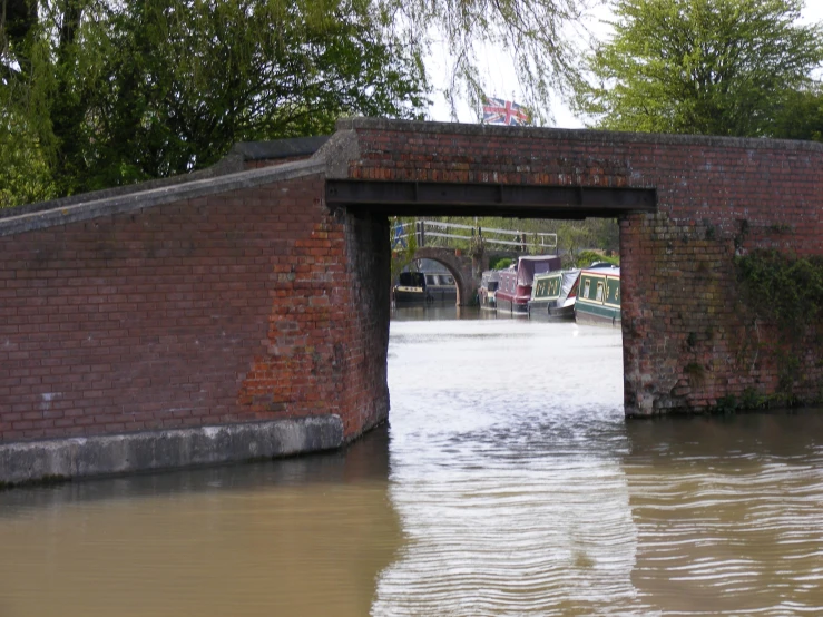 a brick bridge that crosses over some water