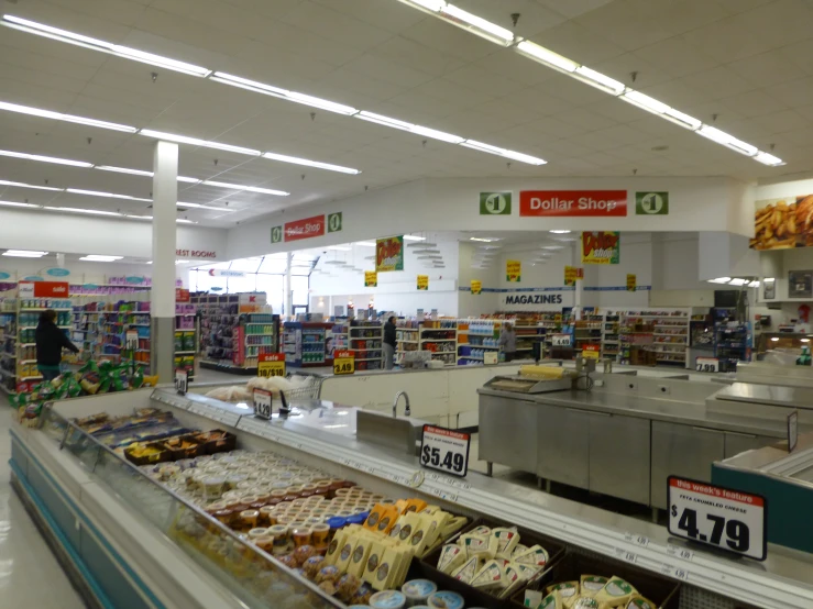 the inside of a grocery store with food on display