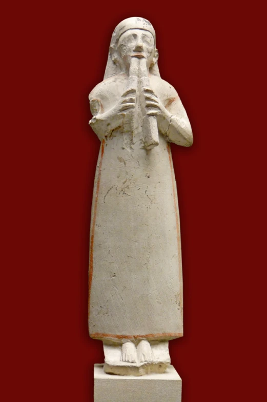 a white statue of a man with a hat and sunglasses