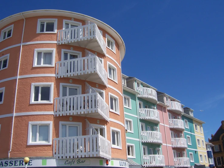 there are many different color balconies on the building