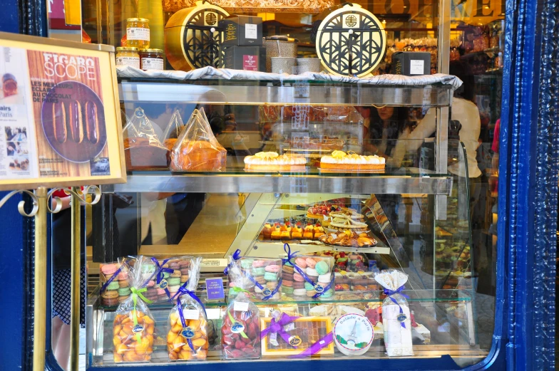bakery display window displaying cookies and pastries