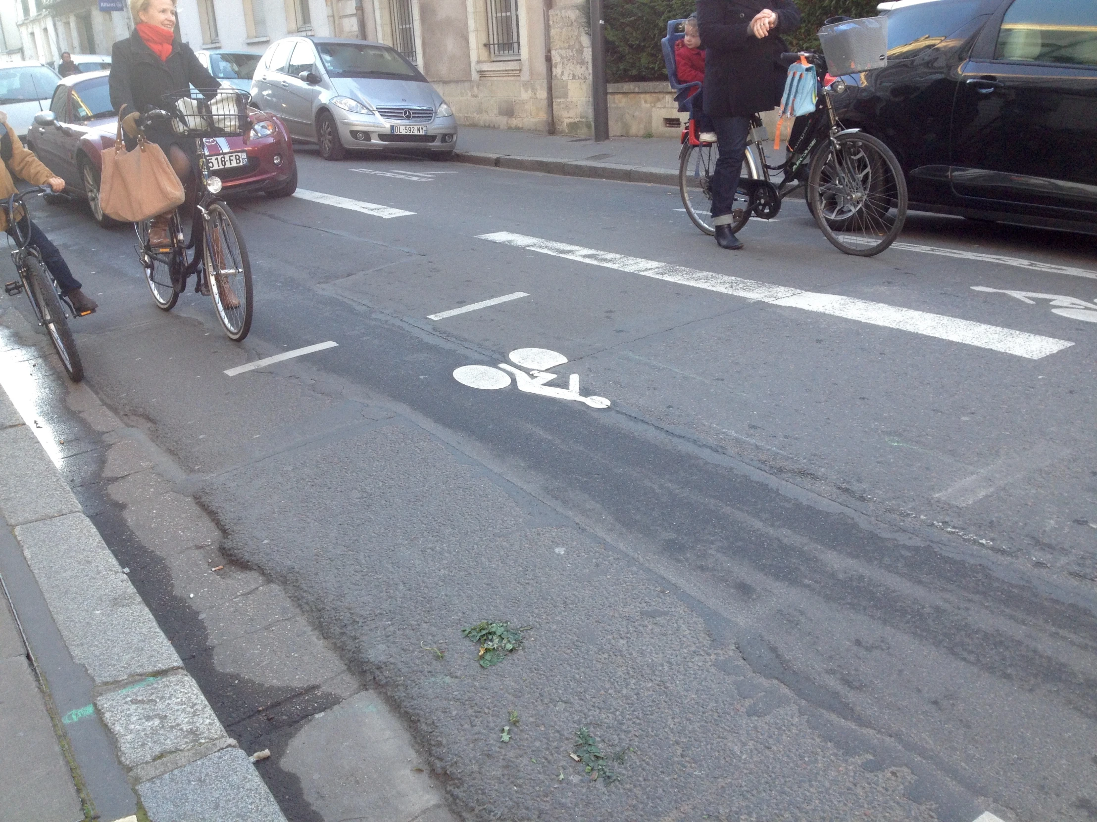 some people on bikes are crossing the street