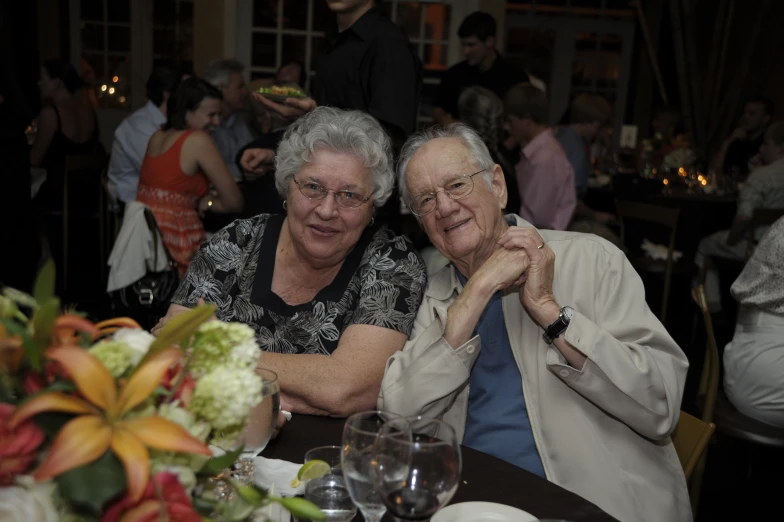 two people sitting at a table together