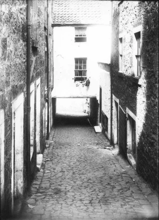 an old street that has been lined with stone and brick